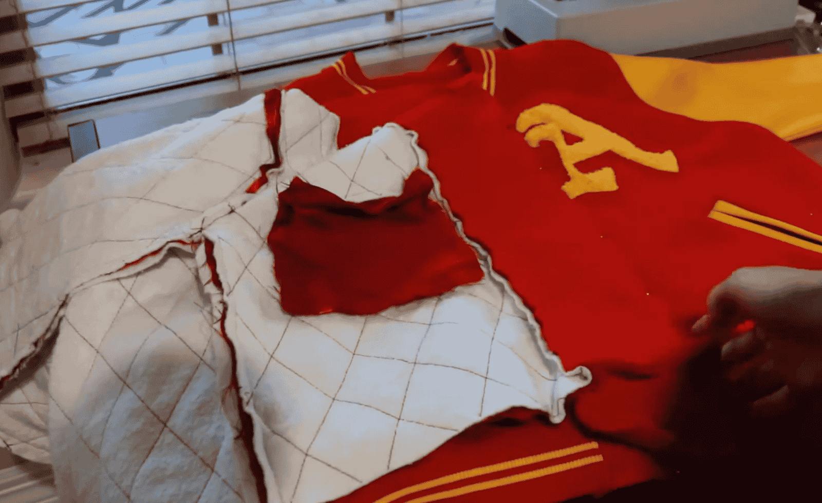 how to design a letterman jacket 1 Pin the left front panel of your jacket to the left front panel of the lining then sew them together.